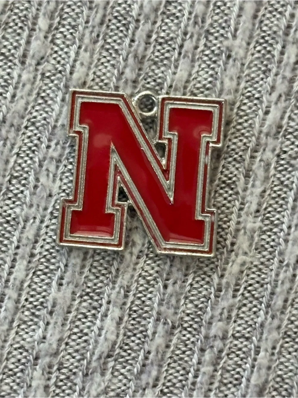 Nebraska Cornhuskers silver tone red N logo pendant